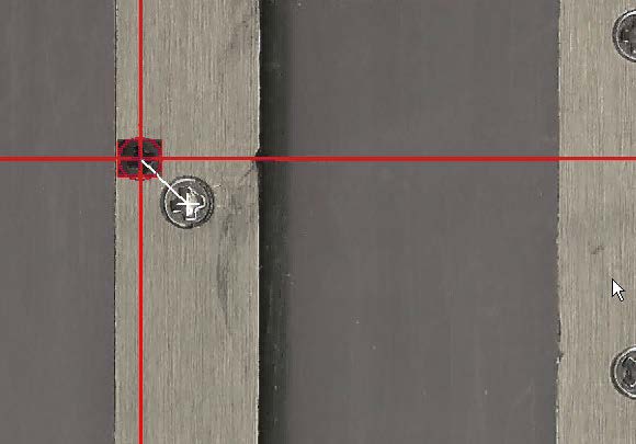 Example image of alignment marks chosen at the center of an image of a screw on the sample holder.